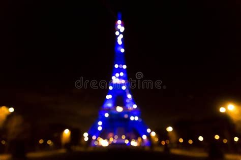 The Iconic Eiffel Tower Illuminated At Night In Paris France