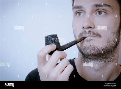 Young Man Smoking Pipe Stock Photo Alamy