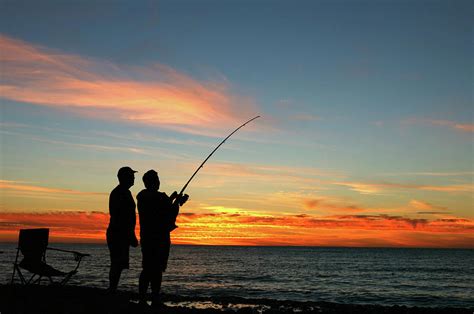 A Silhouette Of Two Men Fishing At Photograph By Jamesbowyer Pixels