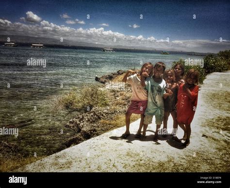 Children Happily Posing Under The Heat Of The Sun Stock Photo Alamy