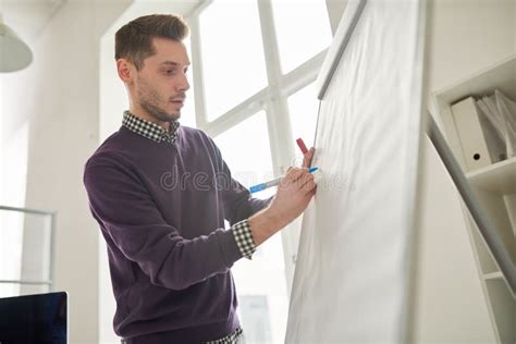 Young Man Writing On Whiteboard Stock Photo Image Of Workplace