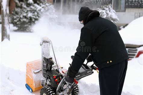 Senior Man Using Snow Blower During Storm Stock Photo Image Of