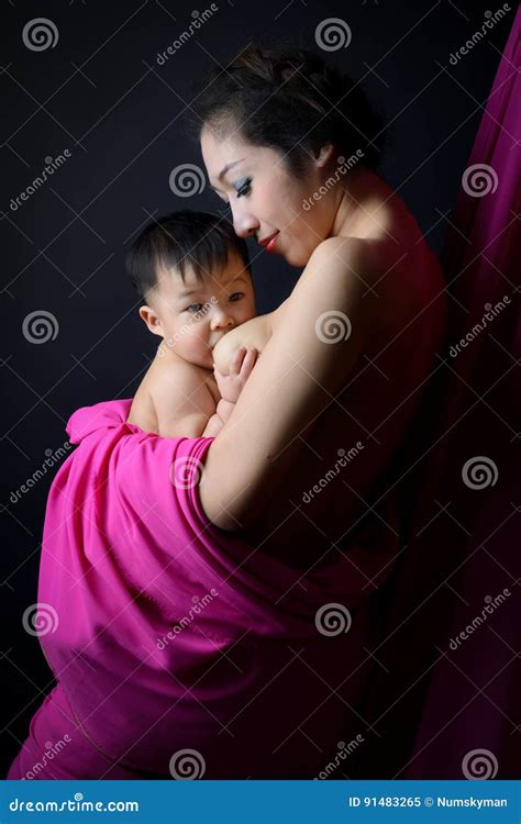 Asian Mother Holding And Breast Feeding Her Baby Stock Image Image Of