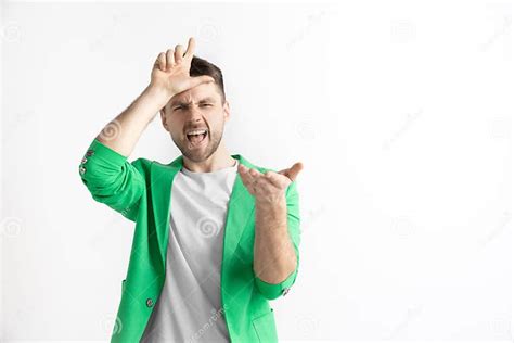 Losers Go Home Portrait Of Happy Guy Showing Loser Sign Over Forehead