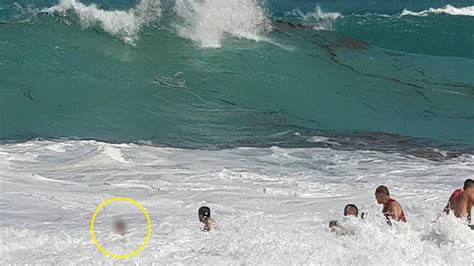 Lifeguards Save Child Caught In Wave Youtube