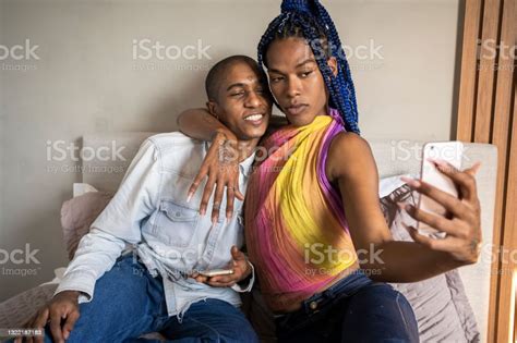 African American Nonbinary Person And Transgender Woman Making Selfie