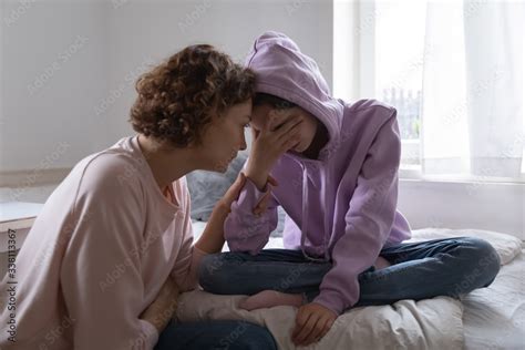 Worried Parent Young Mom Comforting Depressed Crying Teen Daughter