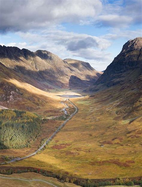 An Aerial View Of Mountains And Rivers In The Scottish Highlands