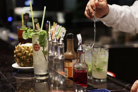 essential liquors and mixers to stock in your home bar