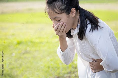 Asian Beautiful Child Girl Covered Her Mouth About To Throw Upvomit