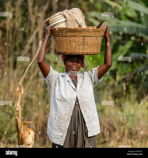 kumasi ghana jan 16 2017 unidentified ghanaian woman carries a basket on her head along the