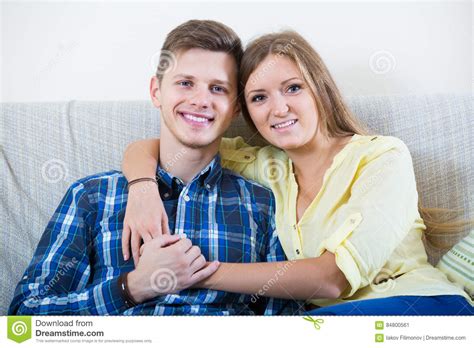 Guy And Pretty Girl Cuddling On Sofa Indoors Stock Image Image Of