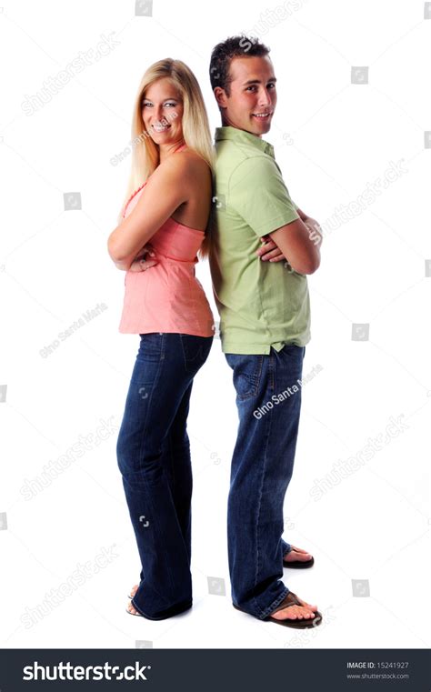 Portrait Of Young Woman And Man Standing Back To Back
