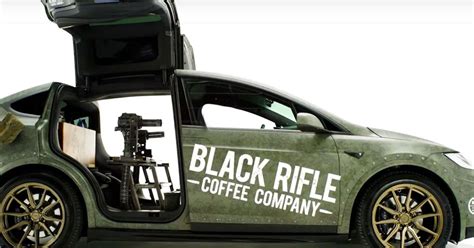 Uh Oh Someone Built A Tesla With Dual Giant Machine Guns