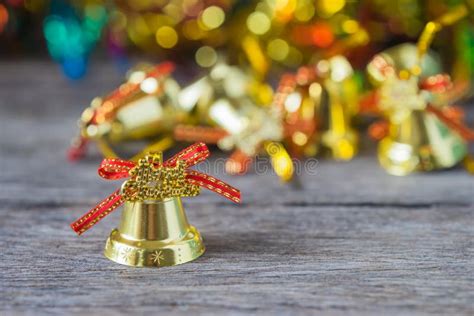 Christmas Gold Bells With Bokeh Decorations Background Stock Photo