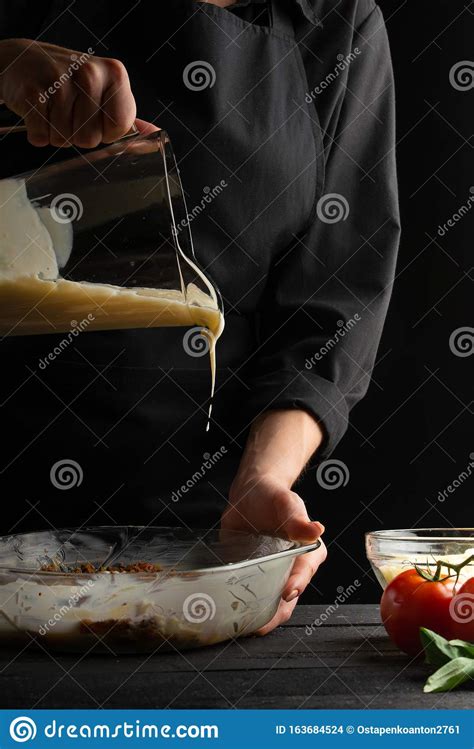 Chef Cooking Italian Dishes On The Background Of Ingredients Freezing