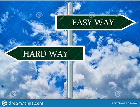 Easy Way And Hard Way Road Signpost With Blue Sky Background Stock Photo