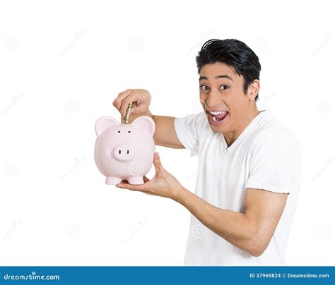 Man Depositing Money Into Piggy Bank Stock Images Image 37969824