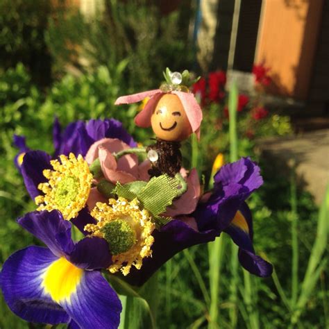 This Adorable Flower Fairy Looks Quite Comfortable Swaying In Her Iris