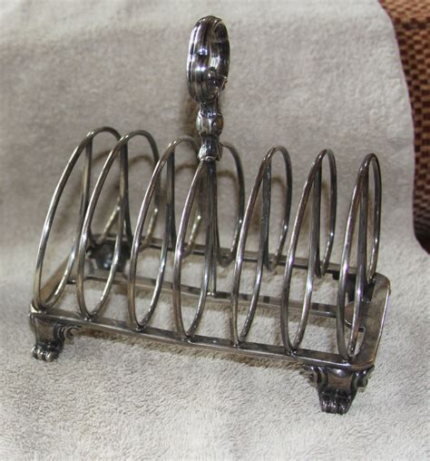 english toast rack sterling includes a mark of v under a crown is this a mark or a monogram