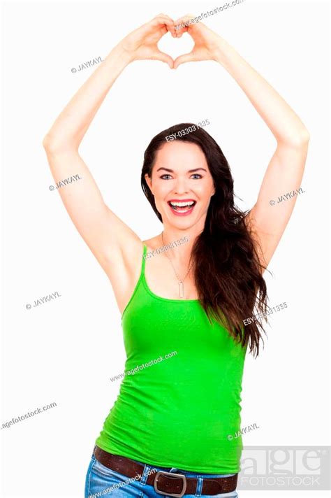 A Beautiful Happy Healthy Young Woman Forming A Love Heart With Her Hands Above Her Head And