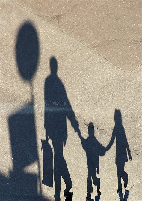 Funny Shadows Of Couple On The Beach With Deep Sunlight Stock Photo