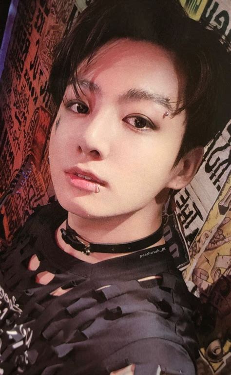A Young Man With Black Hair And Piercings
