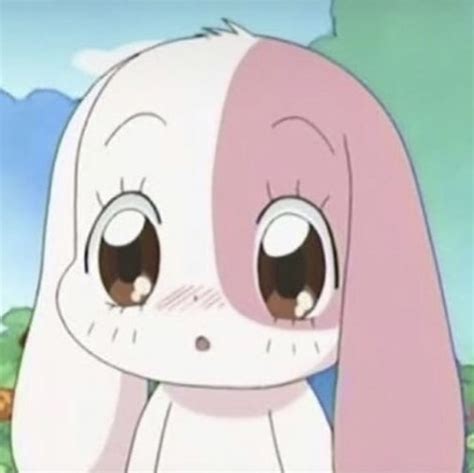 A Cartoon Bunny With Big Eyes Sitting In Front Of Some Bushes And Trees