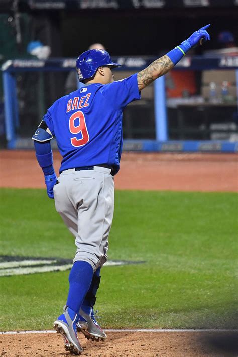 Chicago Cubs Shortstop Javier Baez Points To The Crowd After Hitting A