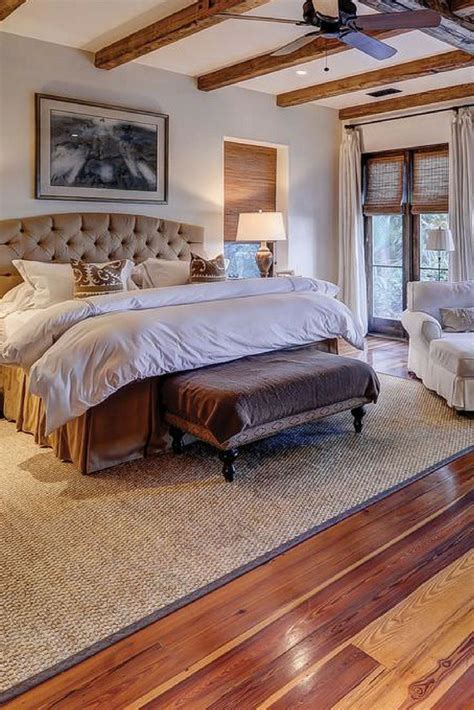 Awesome Master Bedroom With Chair Hardwood Floor And Large Area Rug
