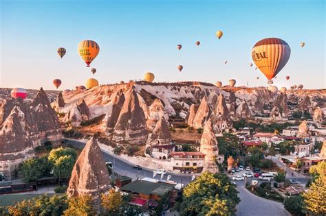many hot air balloons flying over the city in cappadon national park turkey