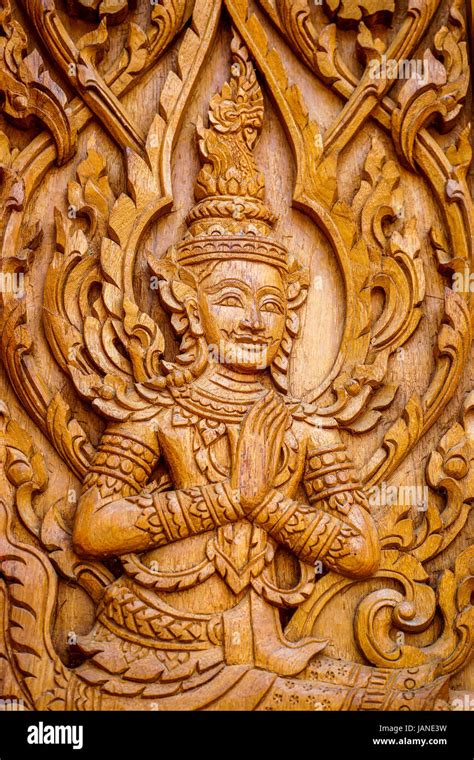 Traditional Thai Art In Wood Carving For Decoration On Buddhist Temple Doors Or Windows Stock
