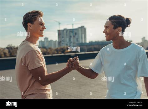 Friends Shaking Hands Stock Photo Alamy