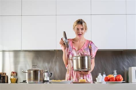 Premium Photo Sexy Kitchen Woman With Cooking Pot Cooking In A