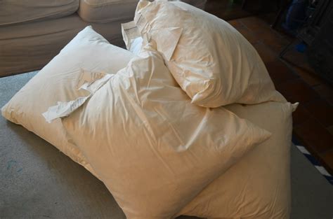 The old pillows in your house can be reused in a multitude of ways. Remodelaholic | Copycat Land of Nod Floor Pouf Tutorial