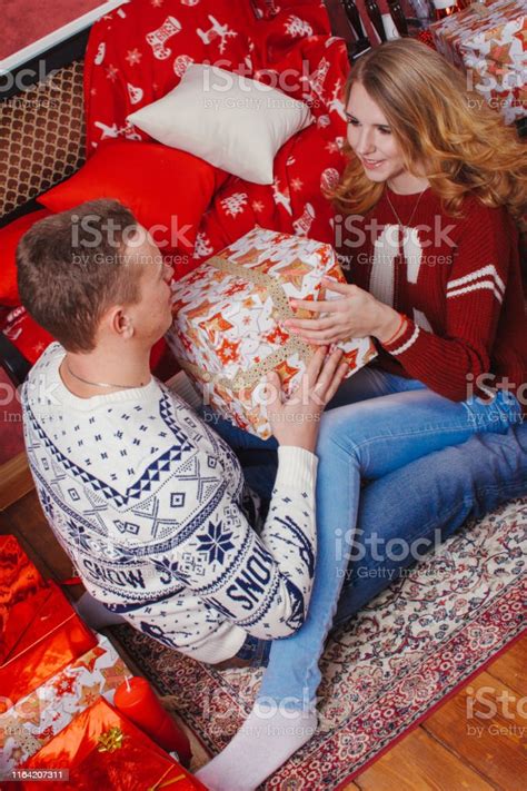 Young Romantic Cute Couple Staying At Home And Enjoying Time Together Lovers Hugging In Cristmas