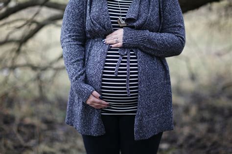 Pregnant Woman Holding Tummy · Free Stock Photo