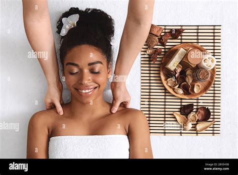 Black Girl Enjoying Body Massage With Aromatherapy Stock Photo Alamy