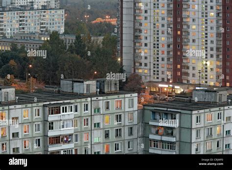 Apartment Buildings In The Evening With Lights In Windows Russia