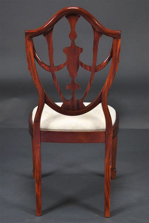 The interpretation of this design varied.1 jefferson's set had pointed shield bottoms and square, tapered legs supported by stretchers. Prince of Wales Mahogany Carved Shield Back Dining Room Chairs