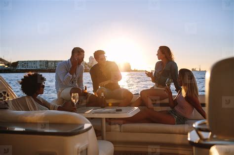 Group Of Friends Partying On Yacht At Sunset Stock Photo 142535