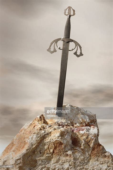 Antique Sword Stuck In Stone Rock High Res Stock Photo Getty Images