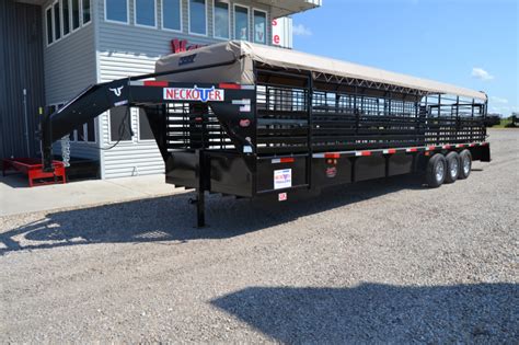 Doesn't matter what you're hauling, rubber diamond plate floors are strong and durable. 2016 Neckover 6'8"x32' Triple Axle Stock Trailer w ...