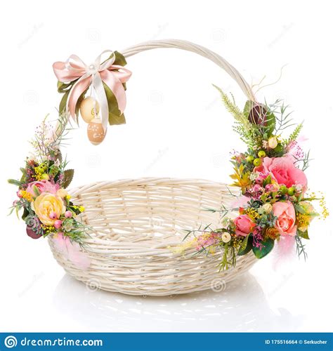White Easter Basket With A Bow On The Handle And A Variety Of Flowers