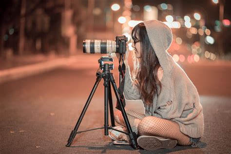 Photographer Sitting On The Road Taking A Photo At Night Image Free