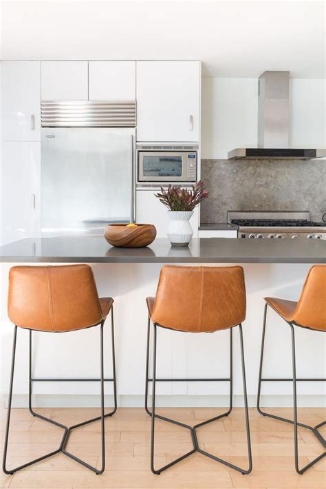 The modern bar stool is used both as a temporary seat for customers at the counter and as a fixed seat, but always for quick meals. Spotted: Our Saddle Leather Bar Stools tying together this ...