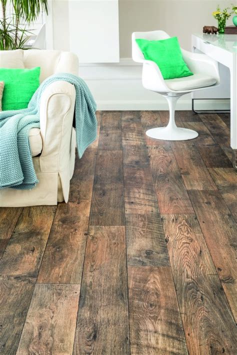 A beautiful golden tone gives modern touch to traditional oak with vinyl flooring by manufacturer objectflor. Tamar Victory Vinyl Flooring | Tapi Carpets & Floors