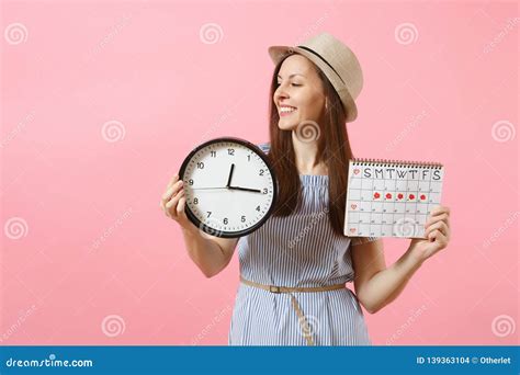 Smiling Pretty Woman In Blue Dress Hat Holding Round Clock Periods