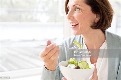 Mature Woman Eating Salad Photo Getty Images