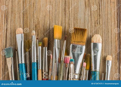 Artist Paint Brushes Over Rustic Wooden Texture Stock Image Image Of
